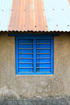 Old color wooden window on cement wallの写真素材