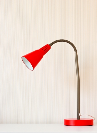 Table and red lamp for interiorの写真素材