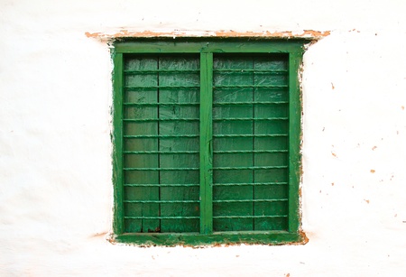 Old color wooden window on wallの写真素材