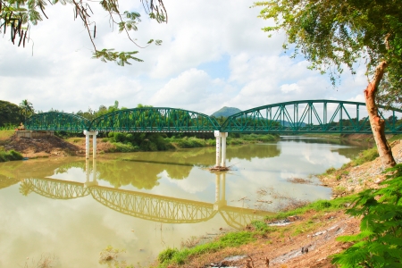 Ancient bridge over the river in Thailandの写真素材