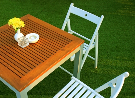 Table and chair setting with flower in outdoor restaurantの写真素材