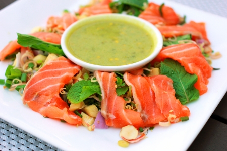 Spicy salmon salad with wasabi sauce の写真素材