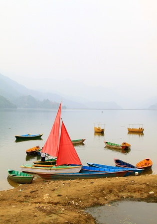 Boats on Phewa lake in Pokhara, Nepal の写真素材