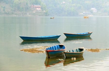 Boats on Phewa lake in Pokhara, Nepal の写真素材