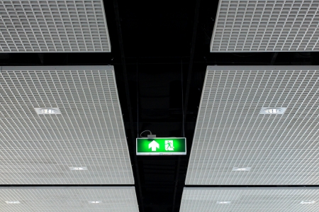 Fire exit sign on ceiling with light