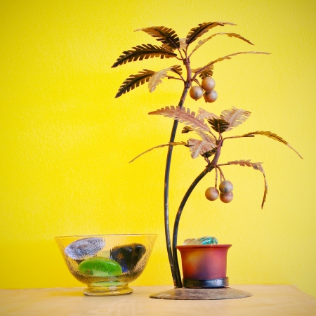 decorative tree and yellow wall with reto filter effectの写真素材