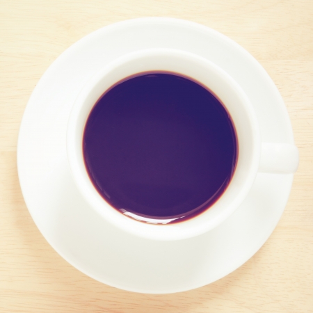 Top view of black coffee with retro filter effectの写真素材