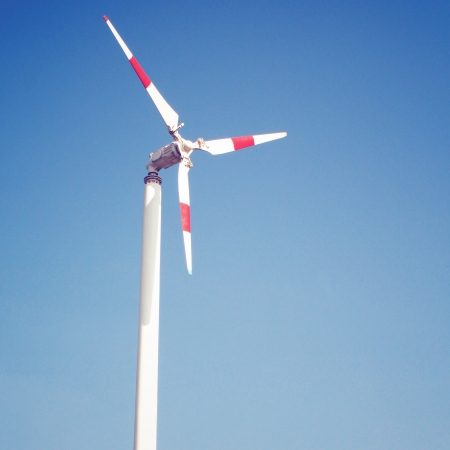 Windmill and blue sky with retro filter effectの写真素材