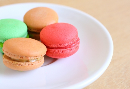 Tasty colorful macaroons on wooden backgroundの写真素材
