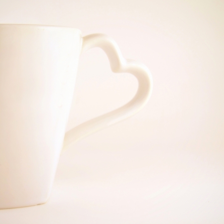 Cup of coffee with heart, retro filter effectの写真素材