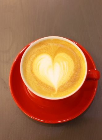 Cappuccino or latte coffee with heart shape の写真素材