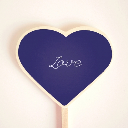 Love word on heart shaped blackboard, retro filter effect の写真素材