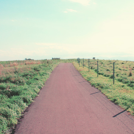 Landscape of the road to the hill with retro filter effectの写真素材