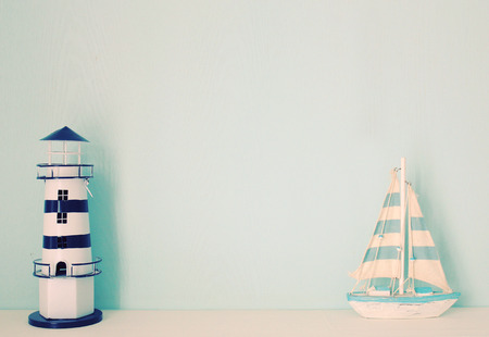 Lighthouse and ship model for decorated in room with retro filter effectの写真素材
