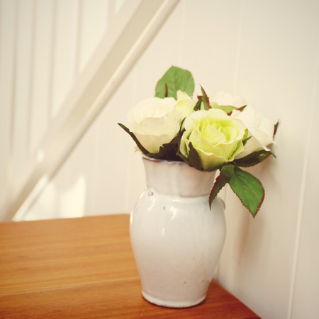 Rose in flowerpot for decoration with retro filter effectの写真素材