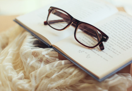 Eyeglasses and book with retro filter effectの写真素材