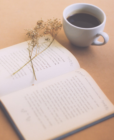 Book with black coffee , retro filter effectの写真素材