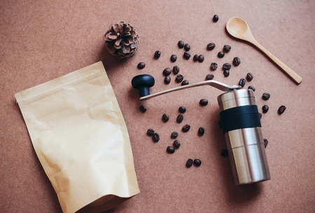 Coffee grinder and bag with coffee beans, retro filter effectの写真素材