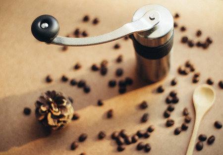 Coffee grinder and spoon with coffee beans, retro filter effectの写真素材