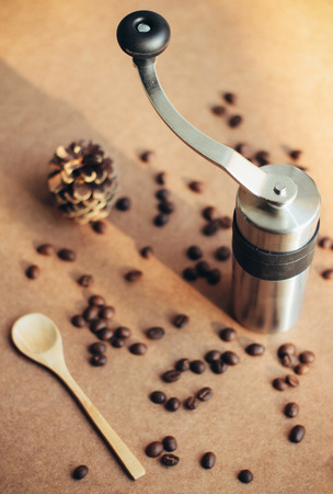 Coffee grinder and spoon with coffee beans, retro filter effectの写真素材