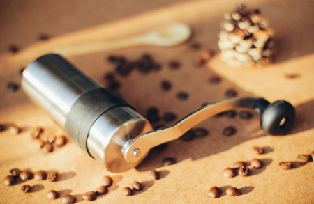 Coffee grinder and spoon with coffee beans, retro filter effectの写真素材