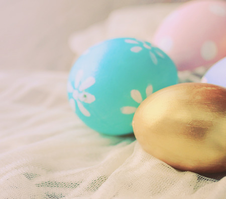 Pastel easter eggs on cloth with retro filter effectの写真素材
