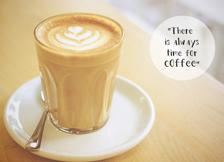 Inspirational quote with cup of coffee with retro filter effectの写真素材