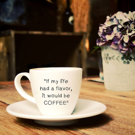 Inspirational quote on cup of coffee with retro filter effectの写真素材