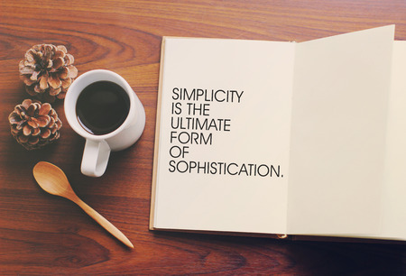 Inspirational motivating quote on notebook and coffee with retro filter effectの写真素材