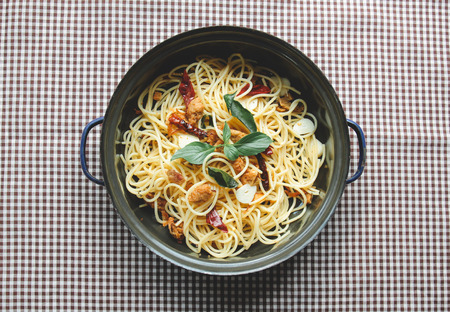 Homemade spaghetti on tableclothの写真素材