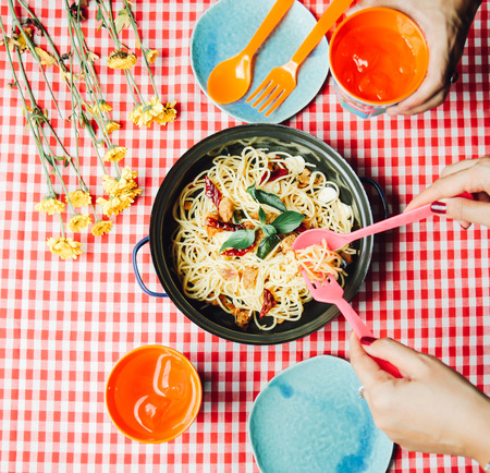 Eating homemade spaghetti with friendの写真素材