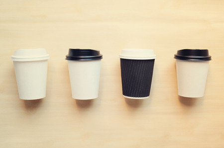 Paper coffee cup mock up for identity branding with retro filter effectの写真素材