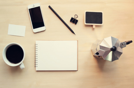 Workspace and coffee mock up set with retro filter effectの写真素材