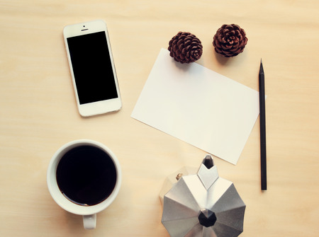 Workspace and coffee mock up set with retro filter effectの写真素材