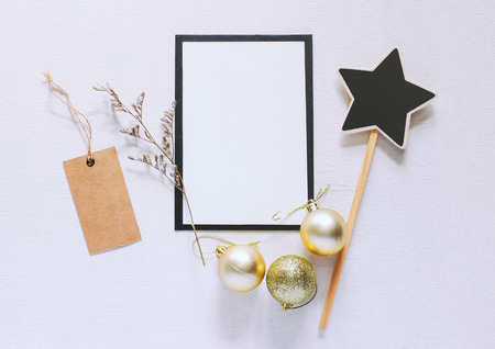 Craft and letter mock up with christmas ornaments on white wood backgroundの写真素材