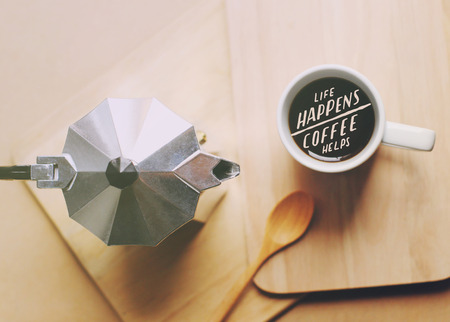 Inspirational motivation quote about coffee on cup of coffee with retro filter effect