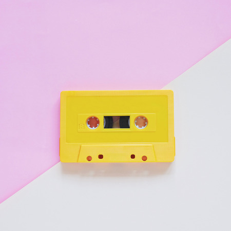 Retro cassette tape on pastel color background, minimal styleの写真素材