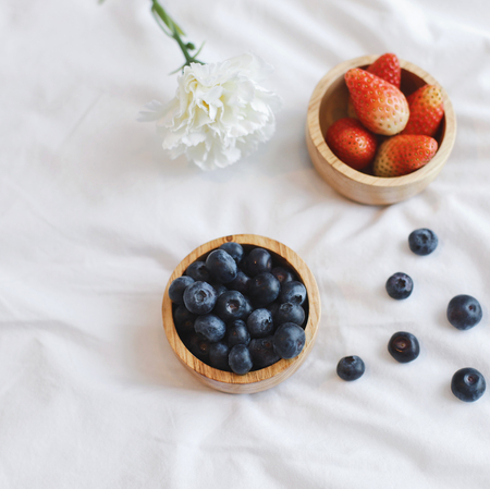 Fresh blueberry and strawberry from the farm serving to bed for breakfastの写真素材