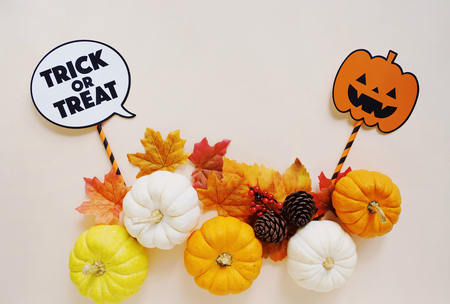 Flat lay of halloween props for party with pumpkins and autumn leaves, copy space, holiday conceptの写真素材