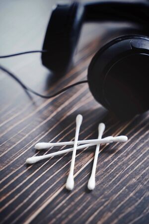 ASMR concept with cotton bud and headphone for enjoying sounds, whisper or music, Autonomous sensory meridian responseの写真素材