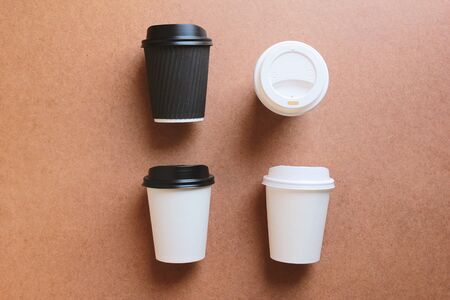 Paper coffee cups take away mock up on wooden background for business branding identity, eco natural paper cups and lifestyle conceptの写真素材