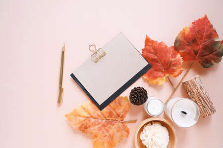 Flat lay of mockup greeting card and autumn holiday concept background, blank card, candle, maple...