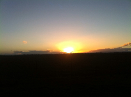 A beautiful sunset over the farmlandsの素材