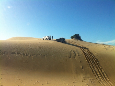 4x4 Vehicles on top of sand dune. Tracks in the sand.の素材