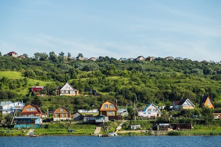 Summer landscape with river and forest on a riverside in sunny dayの写真素材