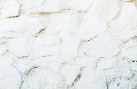 Stone wall pattern. Close up of big concrete bricks outside.の写真素材