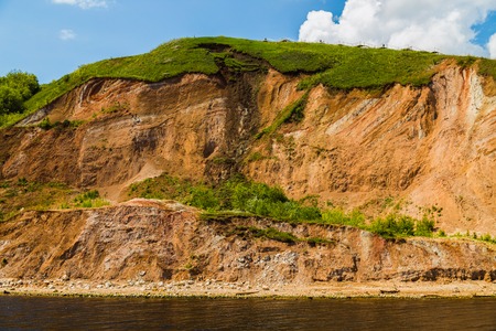Summer landscape with river and forest on a riverside in sunny dayの写真素材