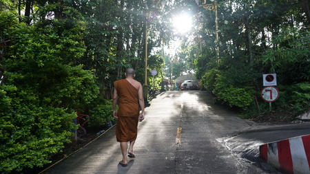 The monk walk to the temple.の写真素材