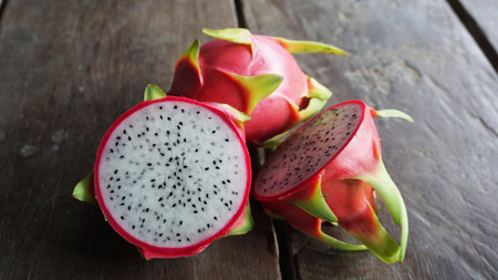 Dragon fruit on the wooden table.の写真素材