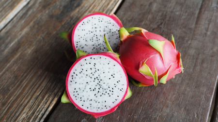 Dragon fruit on the wooden table.の写真素材